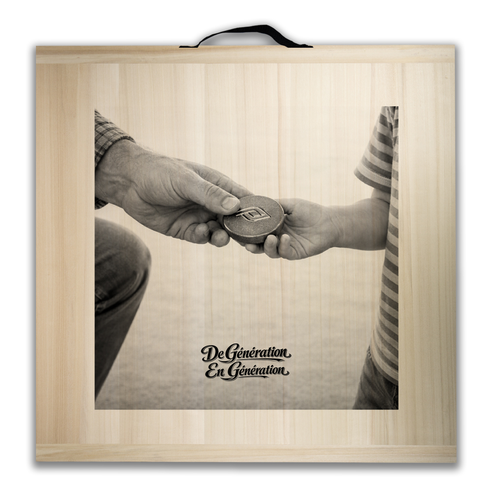Framed sepia photo of an adult handing a round coin-like token to a child, symbolizing generations passing on values.