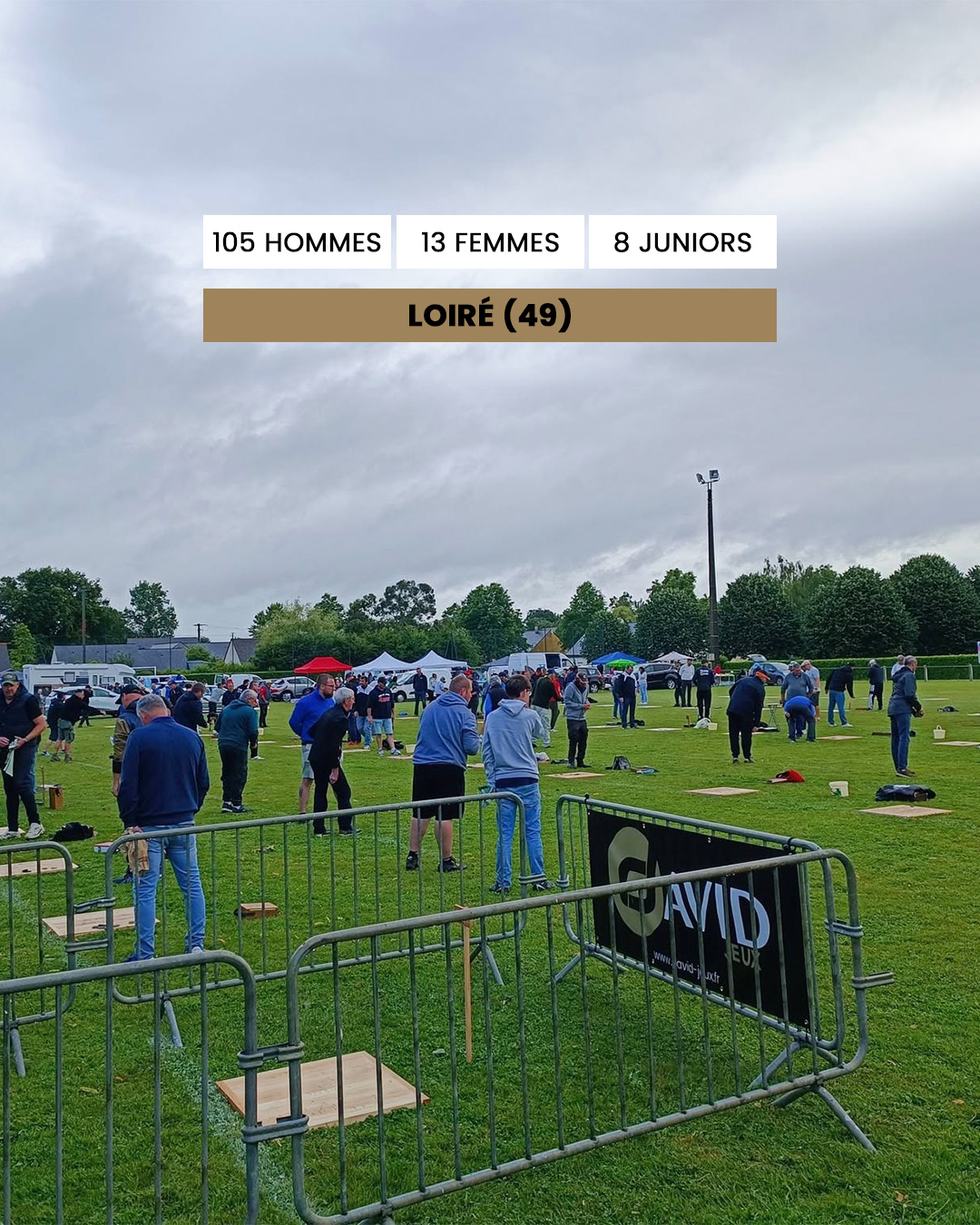 Outdoor community competition on a grassy field with participants lined up at stations; banner reads Loiret (49).