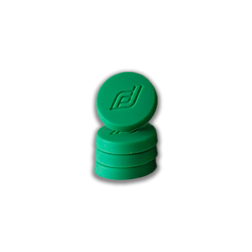 Stack of green circular chips with an embossed logo on the top chip