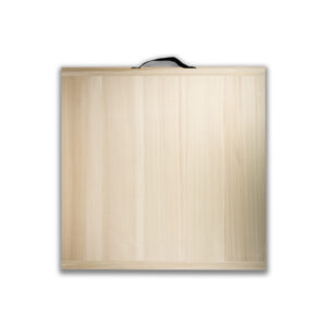 Light plywood lid of a wooden crate with a small black strap handle on top.
